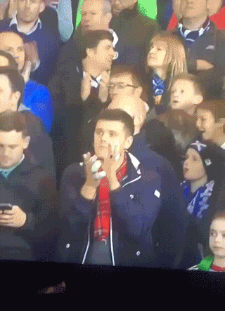 8fa261cd-football-fan-forgets-fingers-are-broken-and-tries-to-clap.gif